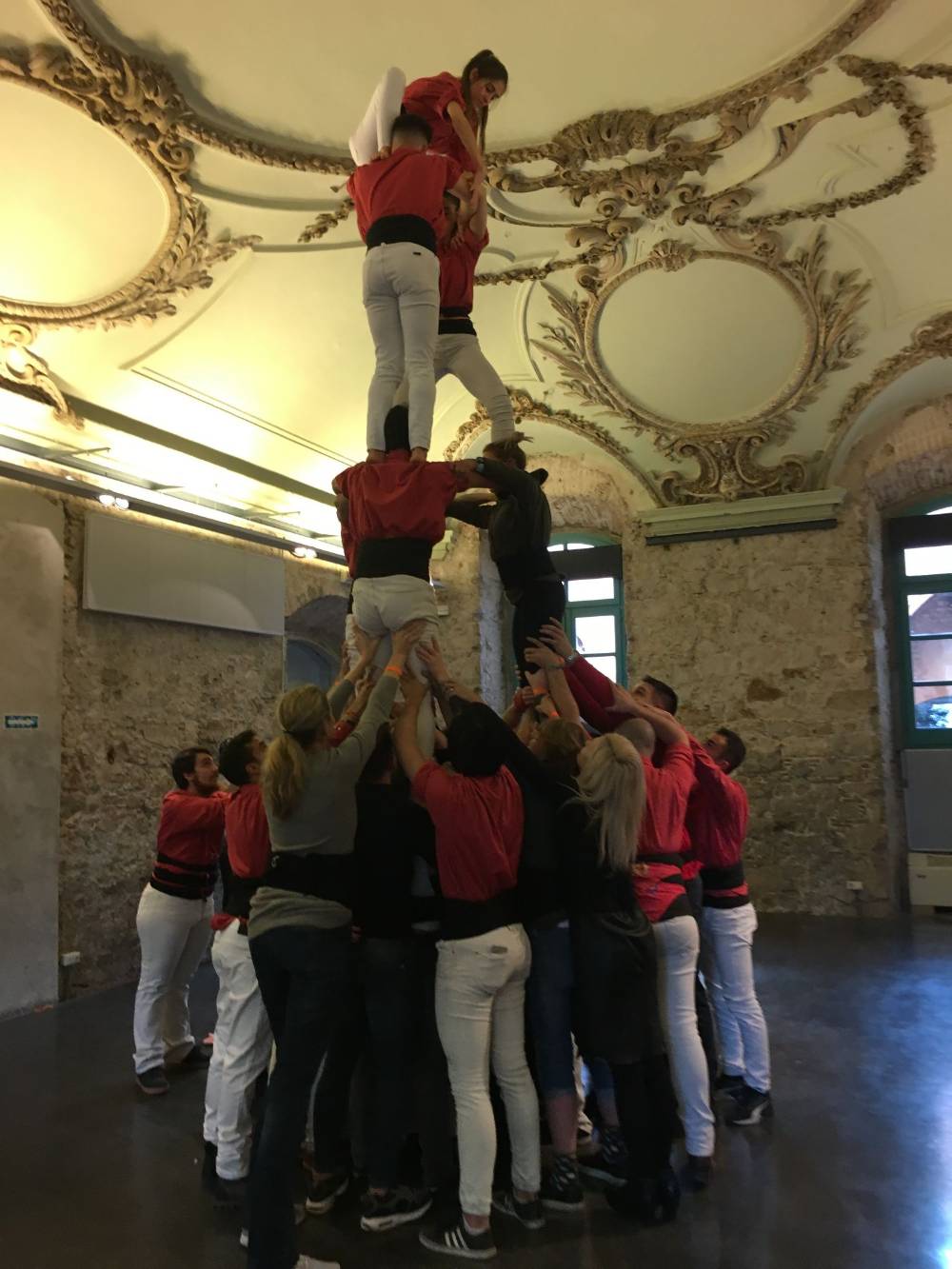 A human tower built indoors during a company workshop
